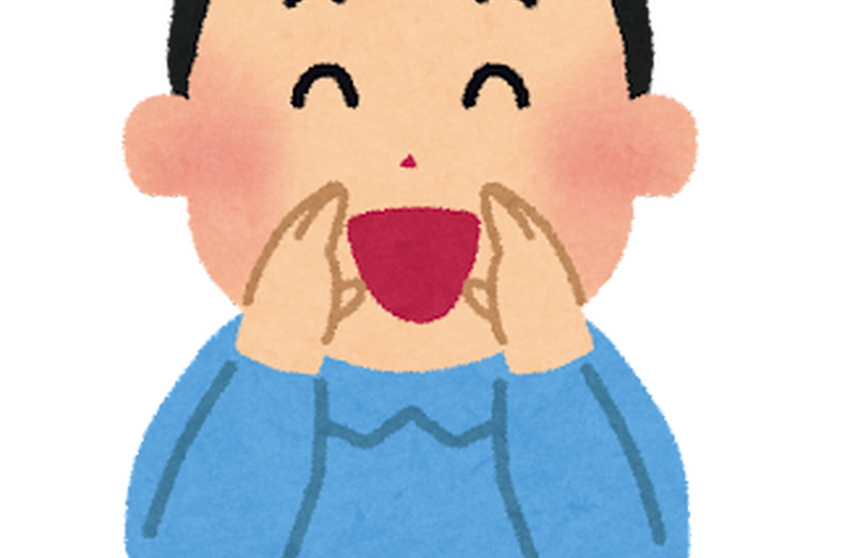 両手を添えて応援する男性