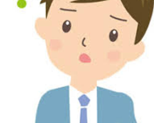 首を傾げるサラリーマン
